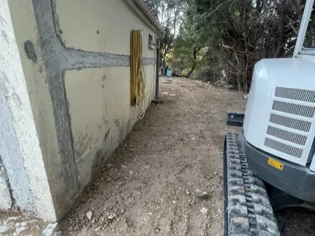 Chaînages, drainage et finitions, chantier 26, réalisation antérieure du dirigeant
